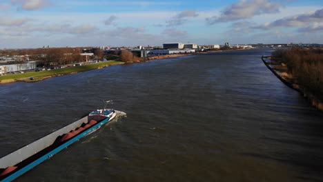 Aerial-Across-Oude-Mass-And-Over-Sjouwer-Cargo-Ship-Passing-Through-Zwijndrecht