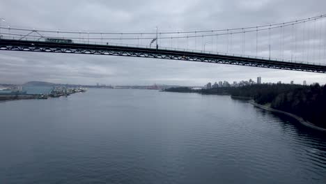 Drone-flying-under-Lions-Gate-Bridge,-Vancouver-in-Canada