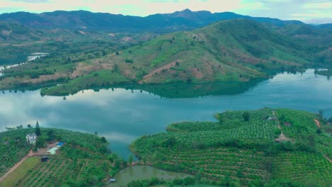 Drone-view-of-Po-Ko-river,-with-coffee-farm-on-the-hill-and-coffee-flower-is-blooming-on-the-hill---Dak-Ha-town,-Kon-Tum-province,-central-highlands-Vietnam