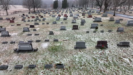 Winter-cemetery-aerial-during-snow-flurries