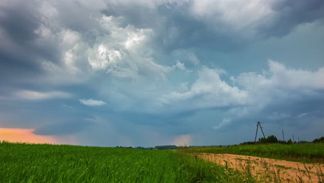 Time-lapse-shot-of-fast-clouds-flying-over-agricultural-field-and-darken-sky,4K---Spectacular-formation-of-dark-clouds-overcast-in-nature