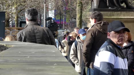 Professional-camera-crew-filming-Ukraine-march-for-news-in-Manchester-city-centre