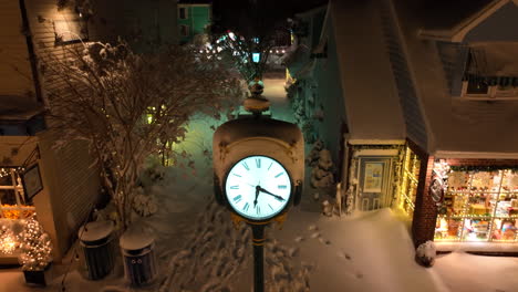 Outdoor-clock-covered-in-snow-at-night