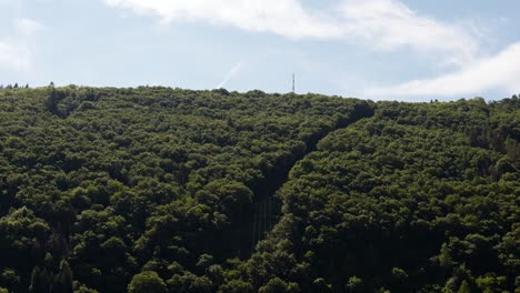 Static-time-lapse-of-few-clouds-flying-by-over-a-lush-hillside-of-the-Moselle-region-in-west-Germany