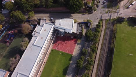 Aerial-top-down-shot-of-school-sports-field-in-Buenos-Aires-during-sunny-day,4K---Soccer-and-Basketball-Field