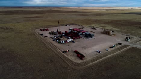 Wide-perspective-drone-orbit-of-a-hydraulic-fracturing-or-fracking-pad-on-the-plains-of-Eastern-Colorado-2021