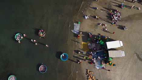 Aerial-View-Looking-Directly-Down-with-Vietnamese-People-Fishing-Along-Mui-Ne-Beach-in-Vietnam