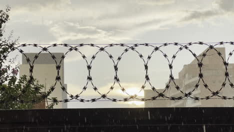 Looped-Barbed-Wire-Property-Security-Wall-Fence-In-Bauru-City,-Brazil