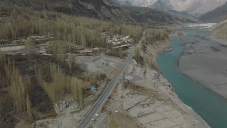 Aerial-View-Of-Karakoram-Highway-Road-Beside-River-At-Hunza-Valley