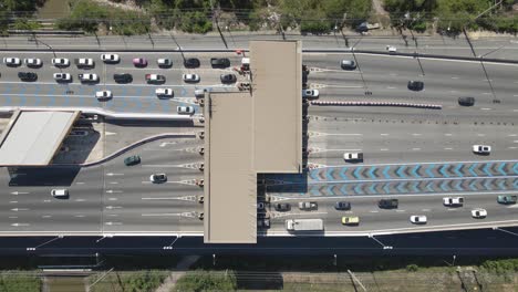 Aerial-top-down-view-Cars-passing-Toll-gateway-on-Highway-multi-lane-road