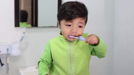 Mexican-baby-learning-to-brush-his-teeth