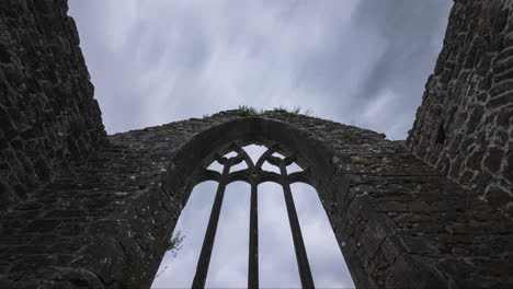 Motion-time-lapse-of-Creevelea-Abbey-medieval-ruin-in-county-Leitrim-in-Ireland-as-a-historical-sightseeing-landmark-with-dramatic-clouds-in-the-sky