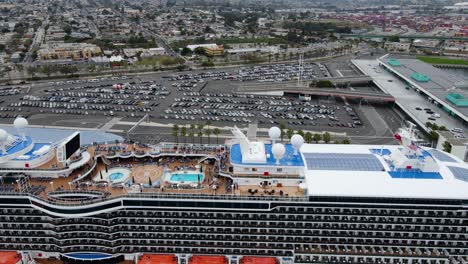 Aerial-view-of-a-cruise-liner-and-the-Los-Angeles-World-Cruise-Center-terminal---tracking,-drone-shot