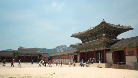 Tourists-walking-through-the-Geunjeongmun--of-Gyeongbokgung-Palace
