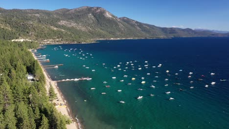 Aerial-Panorama-Of-Charter-Boats-Floating-On-Calm-Blue-Water-Of-Lake-Tahoe,-California-USA