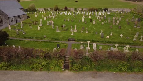 Aerial-pan-across-Crantock-churchyard-Cemetery-graveyard