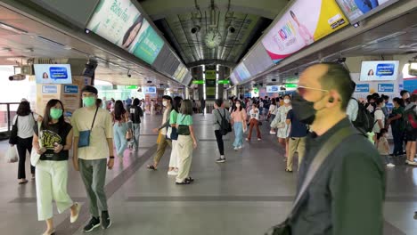 Tourists-and-commuters-at-Siam-BTS-station-,-main-interchange,-public-transport-of-Bangkok-city