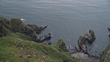 Majestic-steep-high-cliff-side-of-Runde-island,-view-from-above