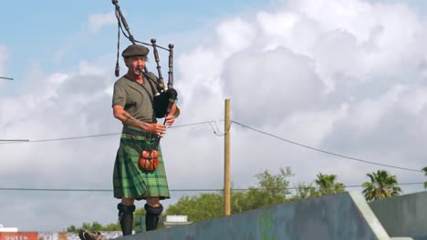 Man-Plays-Bagpipes-on-Bridge-New-Orleans-Day