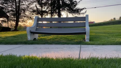 local-sidewalk-bench-in-small-town