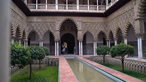Sliding-reveal-inside-famous-Alcazar-Palace-in-Seville,-Spain