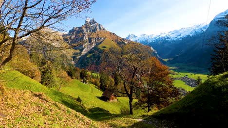 Gondola-going-down-the-mountain-on-a-breathtaking-autumn-scenery-in-Switzerland,-Europe