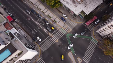 Aerial-view-of-linear-movement-of-traffic-at-intersection-of-Cordoba-Avenue-fork-in-Buenos-Aires,-Argentina
