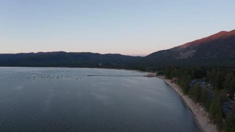 Wide-aerial-shot-of-the-boat-marina-in-South-Lake-Tahoe-at-low-light-in-the-summer