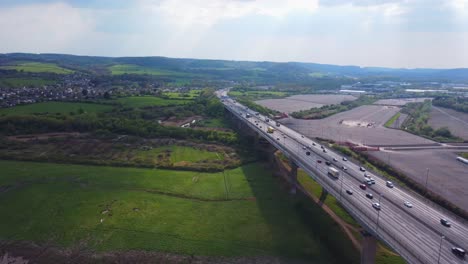 Static-Drone-shot-looking-South-over-the-river-avon-with-the-busy-M5-motorway-traffic-below-with-portbury-and-pill-in-the-distance