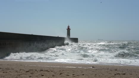 Waves-crashing-on-For-do-Douro-lighthouse,-Porto,-Portugal