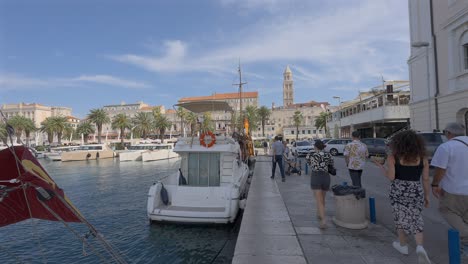 People-walking-by-the-harbor-in-Split,-Croatia