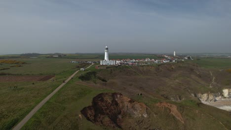 Push-in-aerial-towards-Flamborough-Head-Lighthouse-East-Riding-Yorkshire-England