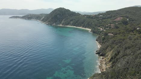 island-of-elba-in-italy-mediterranean-coast-aerial-images-of-the-beach-with-turquoise-blue-waters,-flight-with-drone-european-tourism