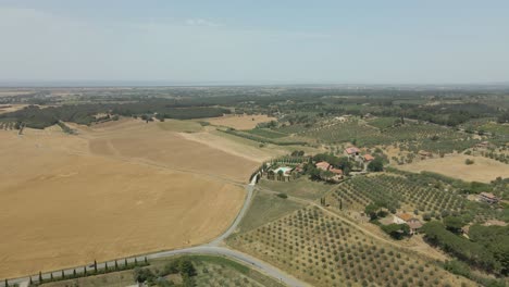 Aerial-images-of-Tuscany-in-Italy-cultivated-fields-summer,-beautiful-italian-landscape