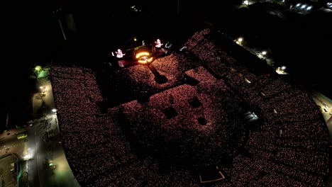 Huge-live-concert-at-night-in-big-outdoor-stadium