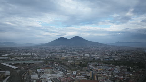 Fast-aerial-zoom-hyperlapse-of-clouds-flying-past-Mount-Vesuvius-in-Naples,-Italy