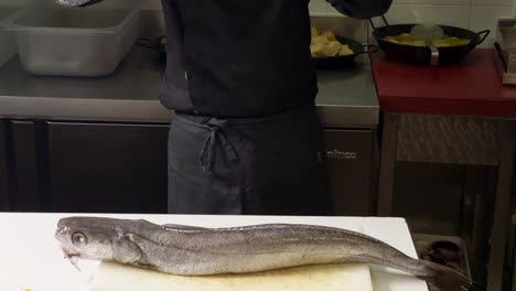 Chef-presents-a-big-hake-ready-to-be-cut-and-cleaned-up