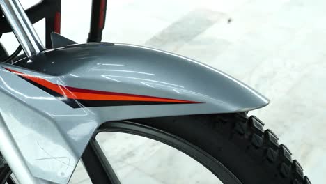 Close-Up-View-Of-Front-Silver-Mudguard-Of-Honda-CB150F