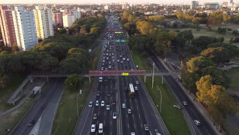 Aerial-circling-view-of-General-Paz-highway-with-car-traffic,-Buenos-Aires-in-Argentina