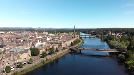 Drone-flying-above-river-Tay-revealing-beautiful-City-of-Perth-and-the-Scottish-Highlands-in-the-distance