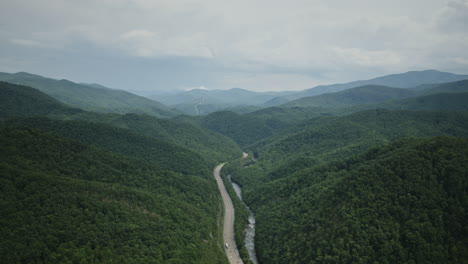 Aerial-hyperlapse-of-I-40-weaving-through-the-mountains-outside-of-Asheville,-North-Carolina
