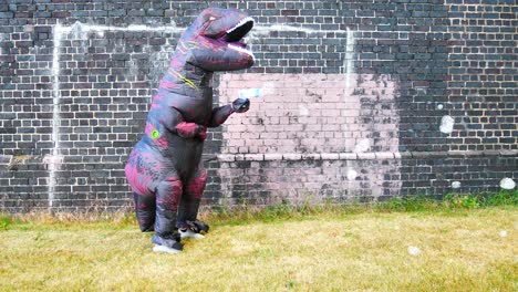 Happy-funny-prehistoric-dinosaur-spraying-bubbles-against-brick-wall