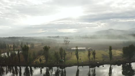 Water-Reflections-on-Foggy-Day-over-River-Canal-in-Xochimilco,-Mexico