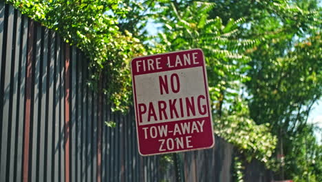 Crooked-fire-lane-no-parking-tow-away-zone-road-sign