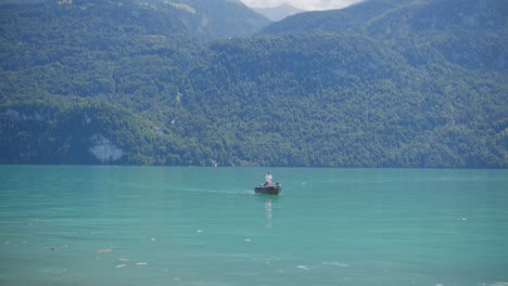 Interlaken,-Switzerland,-people,-boat,-water,-lake,-mountains,-hillside,-Heavenly,-picturesque,-clouds,-wide-pan-view