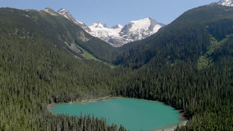 Turquoise-Lake-Surrounded-With-Dense-Trees-In-Joffre-Lakes-Provincial-Park-In-British-Columbia,-Canada
