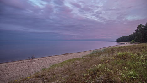 Calm-beach-time-lapse-with-pink-and-violet-clouds