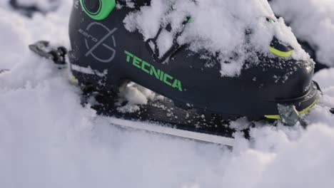 Close-up-on-Tecnica-ski-boot-footwear-in-action-in-snow