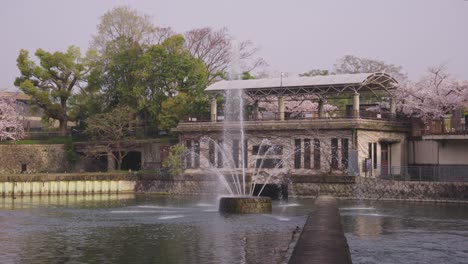 Keage-Incline-Fountain-in-Kyoto-Japan,-Spring-Sakura-in-Background