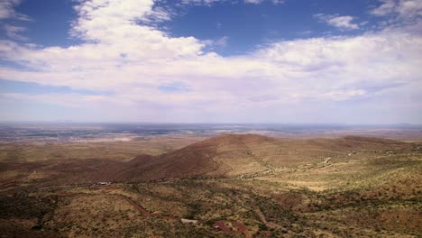 Soaring-high-over-the-foothills-of-Franklin-Mountain-State-Park-in-El-Paso,-Texas